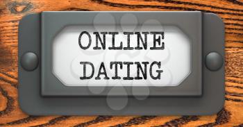 Online Dating - Inscription on File Drawer Label on a Wooden Background.