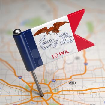 Small Flag of Iowa on a Map Background with Selective Focus.