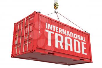 International Trade - Red Cargo Container hoisted with hook Isolated on White Background.
