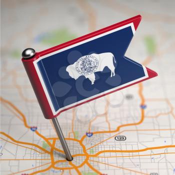 Small Flag of Wyoming on a Map Background with Selective Focus.