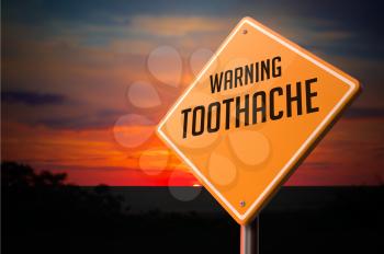 Toothache on Warning Road Sign on Sunset Sky Background.