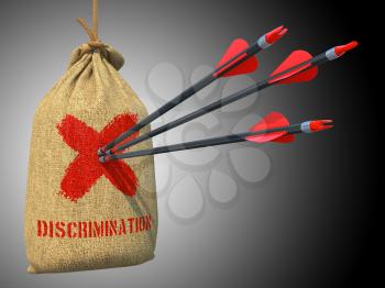 Discrimination - Three Arrows Hit in Red Target on a Hanging Sack on gray Background.