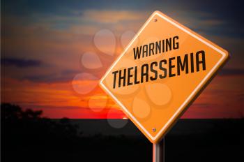 Thalassemia on Warning Road Sign on Sunset Sky Background.