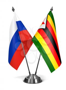 Russia and Zimbabwe - Miniature Flags Isolated on White Background.