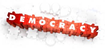 Royalty Free Clipart Image of Democracy Text on Puzzle Pieces