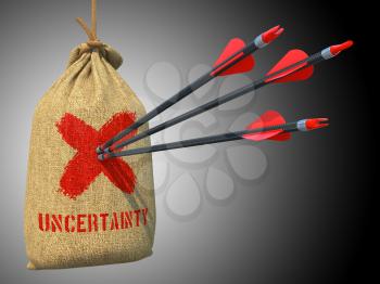 Uncertainty - Three Arrows Hit in Red Target on a Hanging Sack on Grey Background.