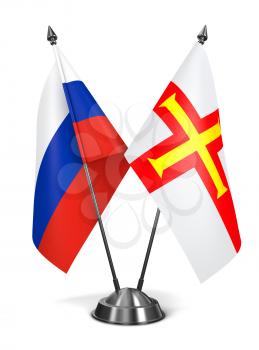 Russia and Guernsey - Miniature Flags Isolated on White Background.