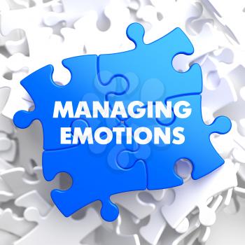 Managing Emotions on Blue Puzzle on White Background.