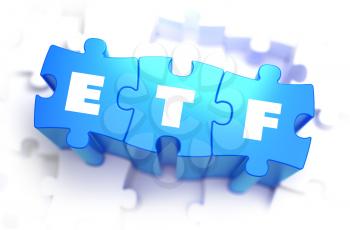 ETF - White Word on Blue Puzzles on White Background. 3D Illustration.