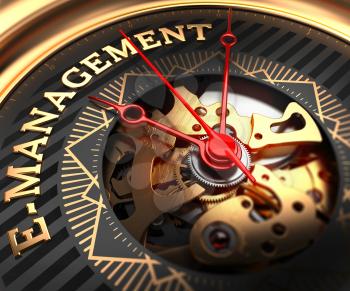 E-Management on Black-Golden Watch Face with Watch Mechanism. Full Frame Closeup.