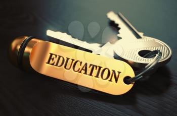 Education Concept. Keys with Golden Keyring on Black Wooden Table. Closeup View, Selective Focus, 3D Render. Toned Image.