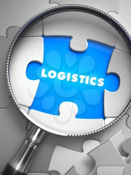Logistics - Word on the Place of Missing Puzzle Piece through Magnifier. Selective Focus.