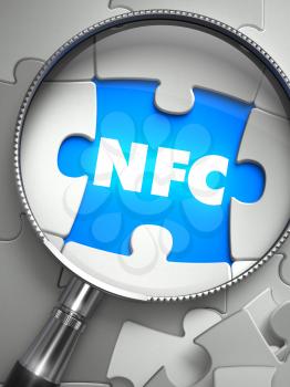 NFC - Near Field Communication - Word on the Place of Missing Puzzle Piece through Magnifier. Selective Focus.