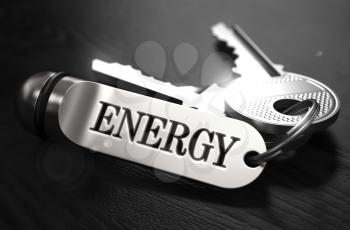 Energy Concept. Keys with Keyring on Black Wooden Table. Closeup View, Selective Focus, 3D Render. Black and White Image.