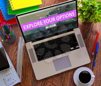 Explore Your Options Concept. Modern Laptop and Different Office Supply on Wooden Desktop background.