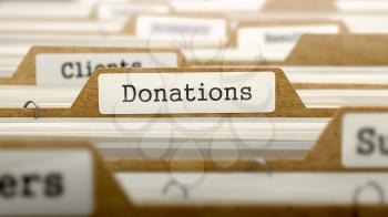 Donations Concept. Word on Folder Register of Card Index. Selective Focus.