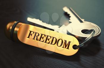 Keys to Freedom - Concept on Golden Keychain over Black Wooden Background. Closeup View, Selective Focus, 3D Render. Toned Image.