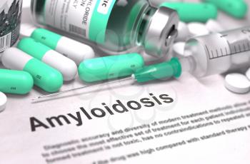 Amyloidosis - Printed Diagnosis with Mint Green Pills, Injections and Syringe. Medical Concept with Selective Focus.