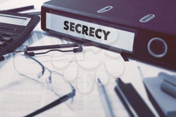 Secrecy - Ring Binder on Office Desktop with Office Supplies. Business Concept on Blurred Background. Toned Illustration.