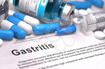 Diagnosis - Gastritis. Medical Concept with Blue Pills, Injections and Syringe. Selective Focus. Blurred Background.