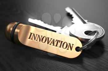 Keys to Innovation - Concept on Golden Keychain over Black Wooden Background. Closeup View, Selective Focus, 3D Render.