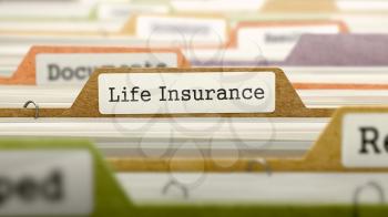 File Folder Labeled as Life Insurance in Multicolor Archive. Closeup View. Blurred Image.