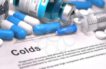 Colds - Printed Diagnosis with Blue Pills, Injections and Syringe. Medical Concept with Selective Focus.
