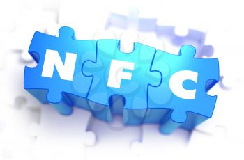 NFC - Near Field Communication - Text on Blue Puzzles on White Background. 3D Render. 