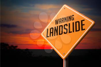 Landslide on Warning Road Sign on Sunset Sky Background.