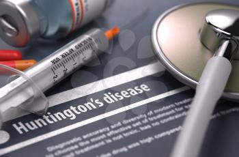 Huntington's disease - Printed Diagnosis on Grey Background with Blurred Text and Composition of Pills, Syringe and Stethoscope. Medical Concept. Selective Focus. 
