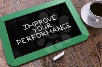Hand Drawn Improve Your Performance. Inspirational Quote  on Small Green Chalkboard. Top View.