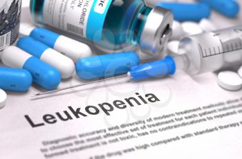 Diagnosis - Leukopenia. Medical Report with Composition of Medicaments - Blue Pills, Injections and Syringe. Blurred Background with Selective Focus.