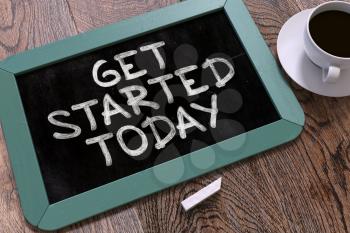 Get Started Today - Inspirational Quote Handwritten by White Chalk on a Blackboard. Composition with Small Blue Chalkboard and Cup of Coffee. Top View.
