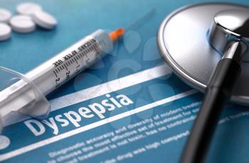 Dyspepsia - Medical Concept with Blurred Text, Stethoscope, Pills and Syringe on Blue Background. Selective Focus.
