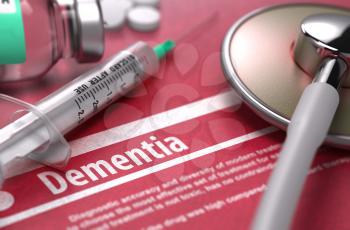 Dementia - Medical Concept on Red Background with Blurred Text and Composition of Pills, Syringe and Stethoscope.