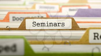 Seminars on Business Folder in Multicolor Card Index. Closeup View. Blurred Image.