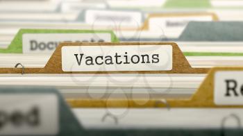 Vacations on Business Folder in Multicolor Card Index. Closeup View. Blurred Image.