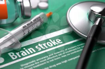 Brain stroke - Medical Concept with Blurred Text, Stethoscope, Pills and Syringe on Green Background. Selective Focus.