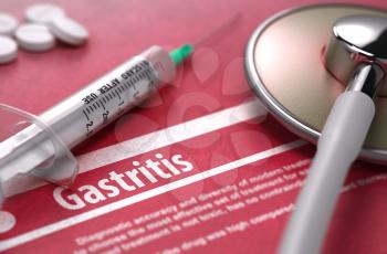 Gastritis - Medical Concept on Red Background with Blurred Text and Composition of Pills, Syringe and Stethoscope.