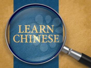 Learn Chinese through Magnifying Glass on Old Paper with Dark Blue Vertical Line Background.
