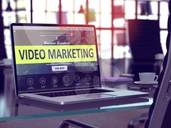 Video Marketing Concept. Closeup Landing Page on Laptop Screen  on background of Comfortable Working Place in Modern Office. Blurred, Toned Image.