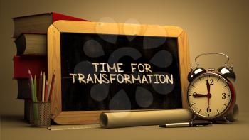 Time for Transformation - Chalkboard with Hand Drawn Text, Stack of Books, Alarm Clock and Rolls of Paper on Blurred Background. Toned Image. 3d Render.