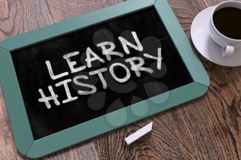 Learn History Concept Hand Drawn on Blue Chalkboard on Wooden Table. Business Background. Top View. 3d Render.