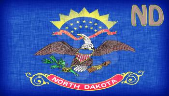 Linen flag of the US state of North Dakota with it's abbreviation stitched on it
