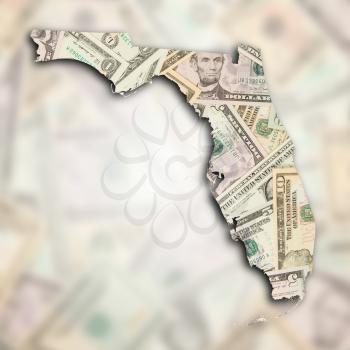 Map of Florida, filled with many dollars