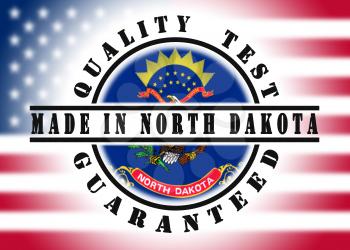 Quality test guaranteed stamp with a state flag inside, North Dakota