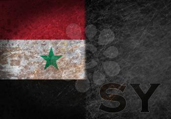 Old rusty metal sign with a flag and country abbreviation - Syria