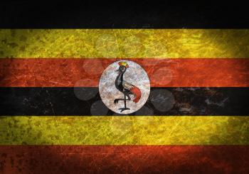 Old rusty metal sign with a flag - Uganda
