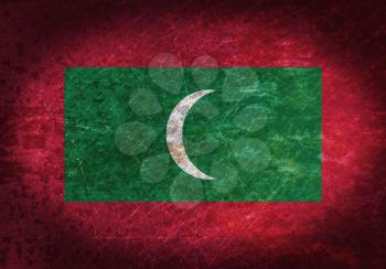 Old rusty metal sign with a flag - Maldives