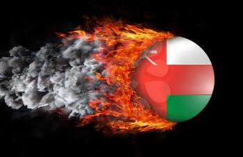 Concept of speed - Flag with a trail of fire and smoke - Oman